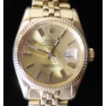 A gentlemans 1990's? 18k gold Rolex Oyster Perpetual Datejust wrist watch, on a 18k gold Rolex
