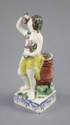 An enamelled creamware figure of Bacchus, attributed Leeds Pottery, c.1790-1800, standing by wine