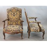 A pair of Louis XVI style mahogany fauteuils, with gadroon and floral scroll carved frames, later
