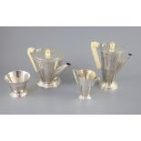 A stylish 1930's Art Deco silver four piece tea and coffee service by Charles Boyton, of conical