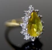 A modern 18ct gold, pear shaped yellow tourmaline and diamond set cluster dress ring, size O,