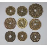 China, 9 bronze charms or amulets, Qing dynasty, seven obv. magical spell characters, rev. Eight