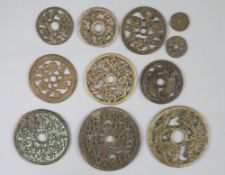 China, 10 bronze open work charms or amulets, Qing dynasty or earlier, seven with plants and