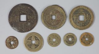 China, 8 bronze charms or amulets, Qing dynasty, six with four characters obverse and two reverse,