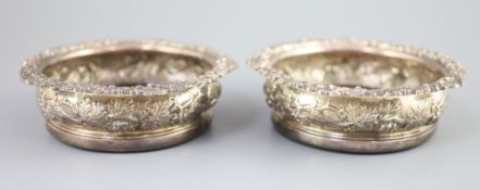 A pair of George IV silver wine coasters, S.C. Younge & Co, Sheffield, 1824, 16.7cm, embossed with