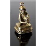 A 19th century gold and black onyx? set fob seal, modelled as a seated monkey with ruby coloured