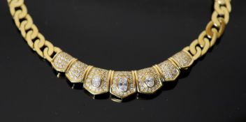 A modern Middle Eastern (possibly Egyptian) gold and diamond set oval curblink necklace, with