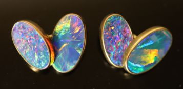 A pair of 18ct gold and black opal set oval cufflinks, 19mm, gross 12.1grams.CONDITION: Due to the