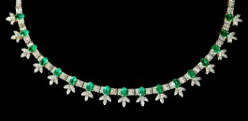 An attractive modern 18k gold, emerald and diamond cluster set choker necklace, set with round