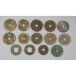 China, 14 cast bronze charms or amulets, Qing dynasty, ten obv. eight characters, rev. pictorial,