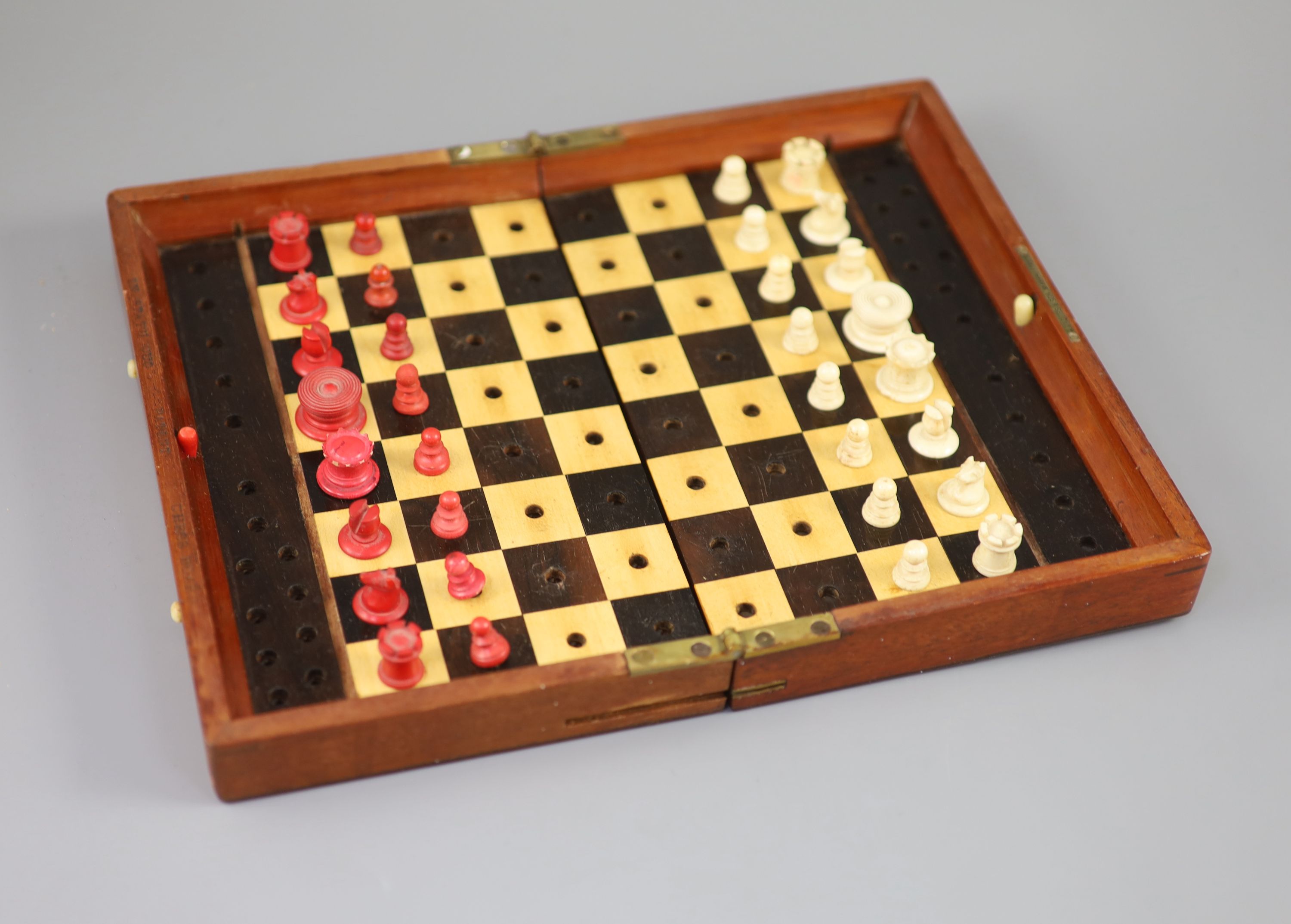 A Jaques & Son Ltd In Statu Quo bone travelling chess set, in mahogany case, c.1860, with brass