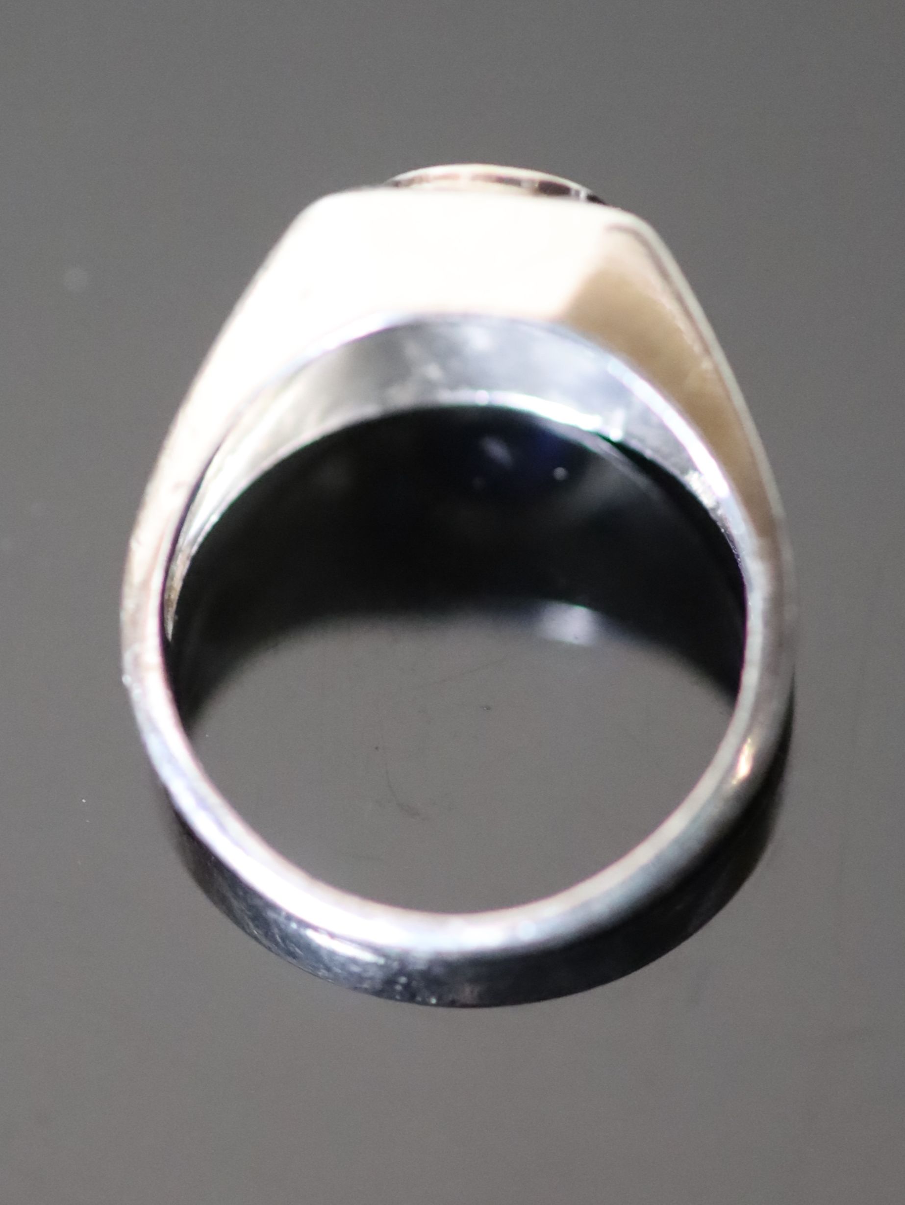 A platinum and single stone synthetic? sapphire set dress ring, with four shaped cut synthetic? - Image 3 of 3