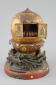 A Japanese lacquer portable shrine (zushi), 19th century, of peach form opening to reveal a female