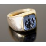 An early 20th century Austro-Hungarian? gold and blue sardonyx set signet ring, the matrix carved