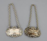 A pair of George IV silver wine labels 'Hollands' & 'Brandy' by Paul Storr, London, 1827, with shell