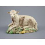 A Ralph Wood the Younger polychrome pottery figure of a recumbent ewe, c.1780-90 , length