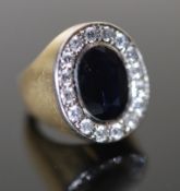 A modern continental 18ct gold (stamped 750), sapphire and diamond cluster set oval dress ring, size