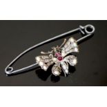 An Edwardian gold and silver, rose cut diamond, white opal and ruby set butterfly brooch, width