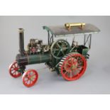 A Maxwell Hemmens Precision Steam Models agricultural traction engine, with green and red paintwork,