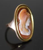 A 19th century gold and oval cameo sardonyx set ring, carved with the bust of a lady to sinister,