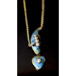 A Victorian gold, enamel, split pearl and cabochon garnet set serpent necklace, with heart shaped