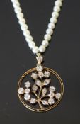 An early 20th century, gold, pearl and diamond set circular pendant necklace, the circular