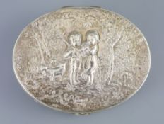 A late 18th/early 19th century French silver oval box, with hinged cover, embossed with children and