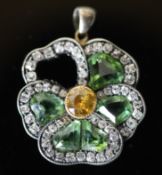 A late Victorian gold and silver, shaped chrysoberyl? and rose cut diamond set 'pansy' cluster