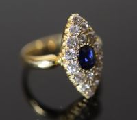 A Victorian 18ct gold, sapphire and diamond set marquise cluster ring, size N, gross 5.4 grams.