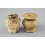 Two Egyptian alabaster cosmetic jars, c.1500 BC and Ptolemaic period (305-30 BC), the older jar with