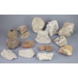 A group of English medieval church/priory architectural stonework and tile fragments, some pieces