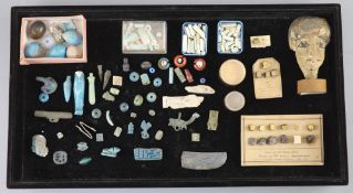 A group of Egyptian stone and turquoise glazed faience amulets, beads and fragments, late Kingdom to