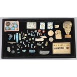 A group of Egyptian stone and turquoise glazed faience amulets, beads and fragments, late Kingdom to