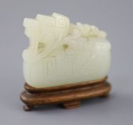 A Chinese archaistic pale celadon jade mandarin duck carving, 19th century, the duck biting a