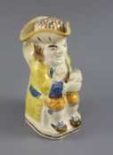 A Staffordshire Prattware 'Good Hearty Fellow' Toby jug with rare hat measure, c.1790-1800, on a