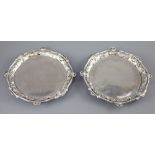 A good pair of George II silver card trays by George Wickes, of shaped circular form, with pierced