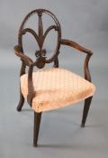 A George III Hepplewhite style mahogany elbow chair, with slender Prince of Wales feather splat,