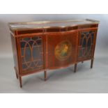 An Edwardian rosewood banded mahogany serpentine dwarf bookcase, with brass gallery and central door