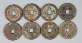 China, a rare set of 8 bronze charms or amulets, late Qing dynasty, 34mm-36mm, 13.5g to 17.5g,