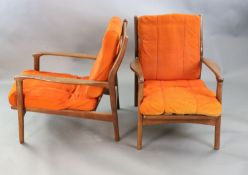 A pair of mid century Danish teak armchairs, with original burnt orange fabric upholstery, W.2ft 2.