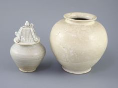 A Chinese cream glazed ovoid jar, Tang dynasty and a Ding type jar and cover, Yuan dynasty, the