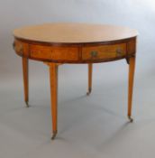 An Edwardian marquetry inlaid satinwood drum top library table, with starburst top inlaid with