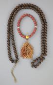 A Sino-Tibetan Buddhist seed bead rosary, 19th century and a Chinese composition bead rosary,