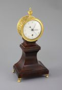 Week's Museum. A Regency gilt brass and mahogany drum case mantel timepiece, with urn final,