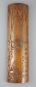 A Chinese bamboo 'bamboo sprig' wrist rest, 18th century, carved in high relief with bamboo and
