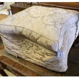 An early 20th century upholstered concave sided footstool, width 65cm, height 42cm
