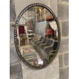 An oval Irish style wall mirror, width 48cm, height 64cm