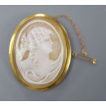 A late Victorian 9ct mounted oval cameo shell brooch, carved with the bust of a lady to sinister,