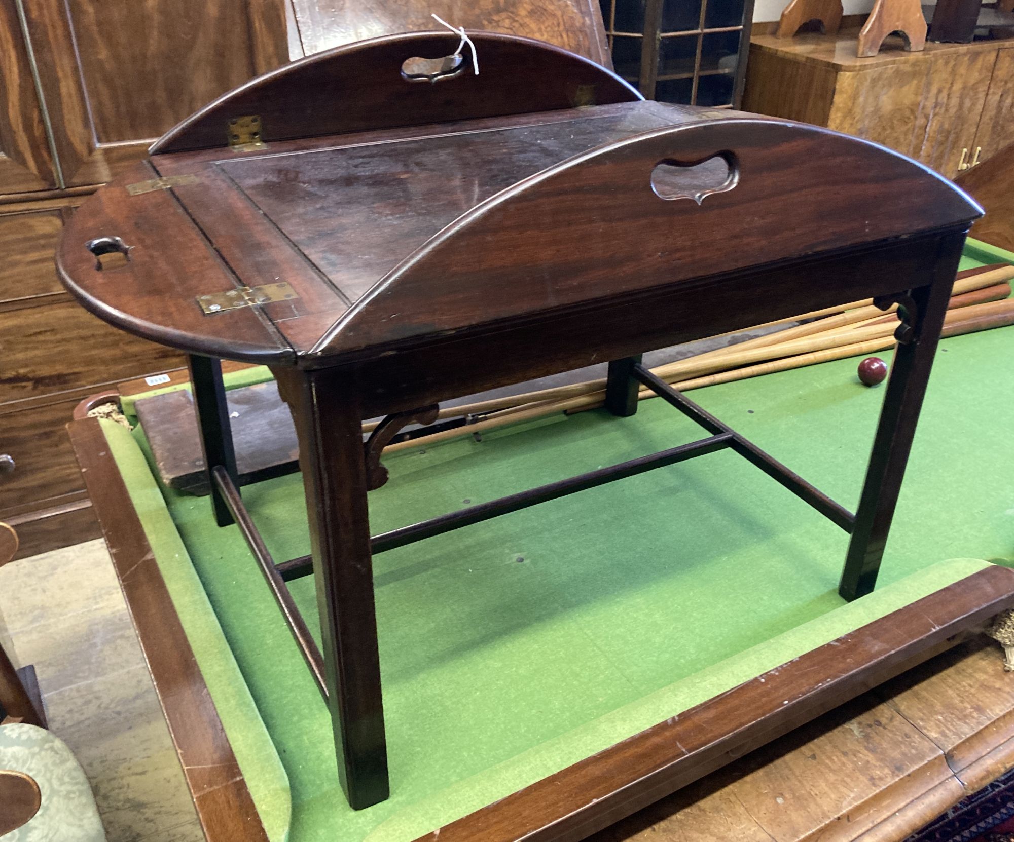 A Victorian mahogany folding butler's tray, width 90cm depth 78cm, on later stand