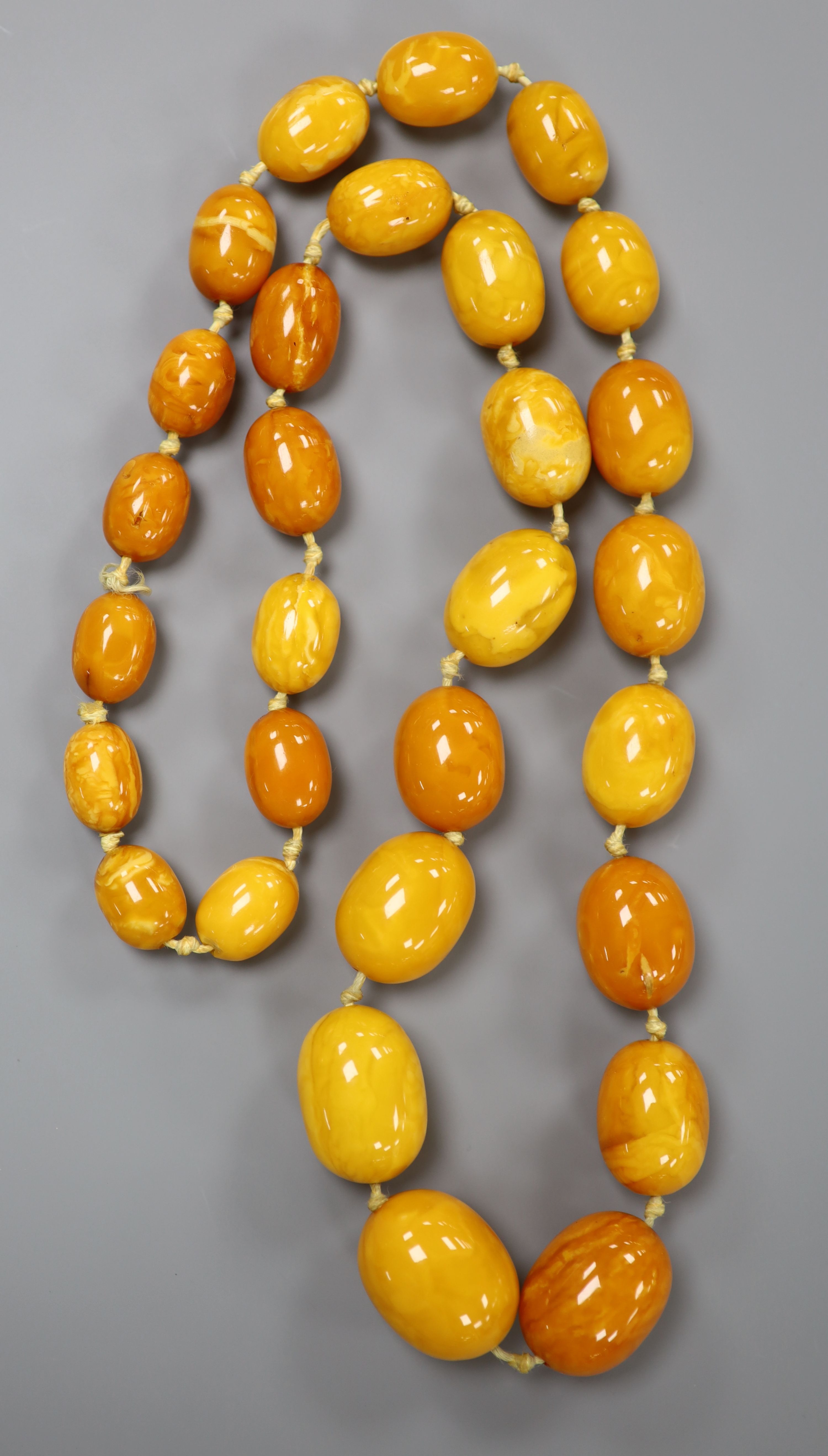 A single strand graduated amber bead necklace, 73cm, gross 101 grams.CONDITION: Largest bead approx. - Image 2 of 4